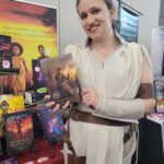 Reader enjoying a novel by African American fantasy and romance author N.D. Jones.