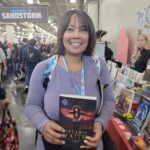 Reader enjoying a novel by African American fantasy and romance author N.D. Jones.