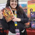 Reader enjoying a novel by African American fantasy and romance author N.D. Jones.