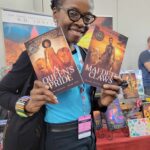 Reader enjoying a novel by African American fantasy and romance author N.D. Jones.