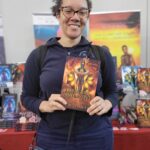 Reader enjoying a novel by African American fantasy and romance author N.D. Jones.