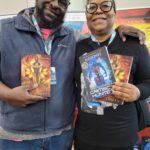 Reader enjoying a novel by African American fantasy and romance author N.D. Jones.