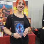 Reader enjoying a novel by African American fantasy and romance author N.D. Jones.