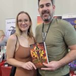 Reader enjoying a novel by African American fantasy and romance author N.D. Jones.