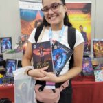 Reader enjoying a novel by African American fantasy and romance author N.D. Jones.