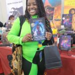 Reader enjoying a novel by African American fantasy and romance author N.D. Jones.