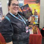 Reader enjoying a novel by African American fantasy and romance author N.D. Jones.