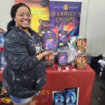 Reader enjoying a novel by African American fantasy and romance author N.D. Jones.