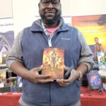 Reader enjoying a novel by African American fantasy and romance author N.D. Jones.