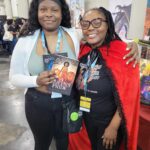 Reader enjoying a novel by African American fantasy and romance author N.D. Jones.