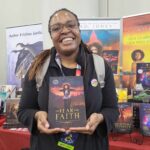 Reader enjoying a novel by African American fantasy and romance author N.D. Jones.