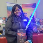 Reader enjoying a novel by African American fantasy and romance author N.D. Jones.