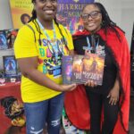 Reader enjoying a novel by African American fantasy and romance author N.D. Jones.