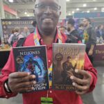 Reader enjoying a novel by African American fantasy and romance author N.D. Jones.