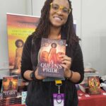 Reader enjoying a novel by African American fantasy and romance author N.D. Jones.
