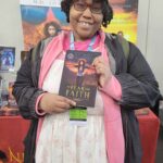 Reader enjoying a novel by African American fantasy and romance author N.D. Jones.