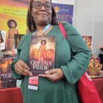 Reader enjoying a novel by African American fantasy and romance author N.D. Jones.