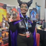 Reader enjoying a novel by African American fantasy and romance author N.D. Jones.