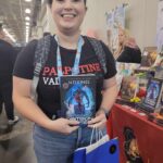 Reader enjoying a novel by African American fantasy and romance author N.D. Jones.