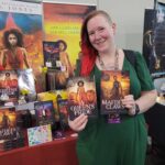 Reader enjoying a novel by African American fantasy and romance author N.D. Jones.