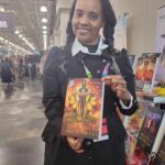 Reader enjoying a novel by African American fantasy and romance author N.D. Jones.