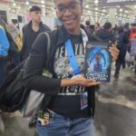 Reader enjoying a novel by African American fantasy and romance author N.D. Jones.