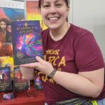Reader enjoying a novel by African American fantasy and romance author N.D. Jones.