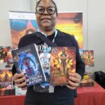 Reader enjoying a novel by African American fantasy and romance author N.D. Jones.