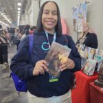 Reader enjoying a novel by African American fantasy and romance author N.D. Jones.