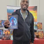 Reader enjoying a novel by African American fantasy and romance author N.D. Jones.
