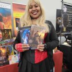Reader enjoying a novel by African American fantasy and romance author N.D. Jones.