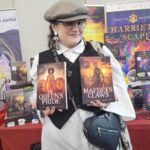 Reader enjoying a novel by African American fantasy and romance author N.D. Jones.