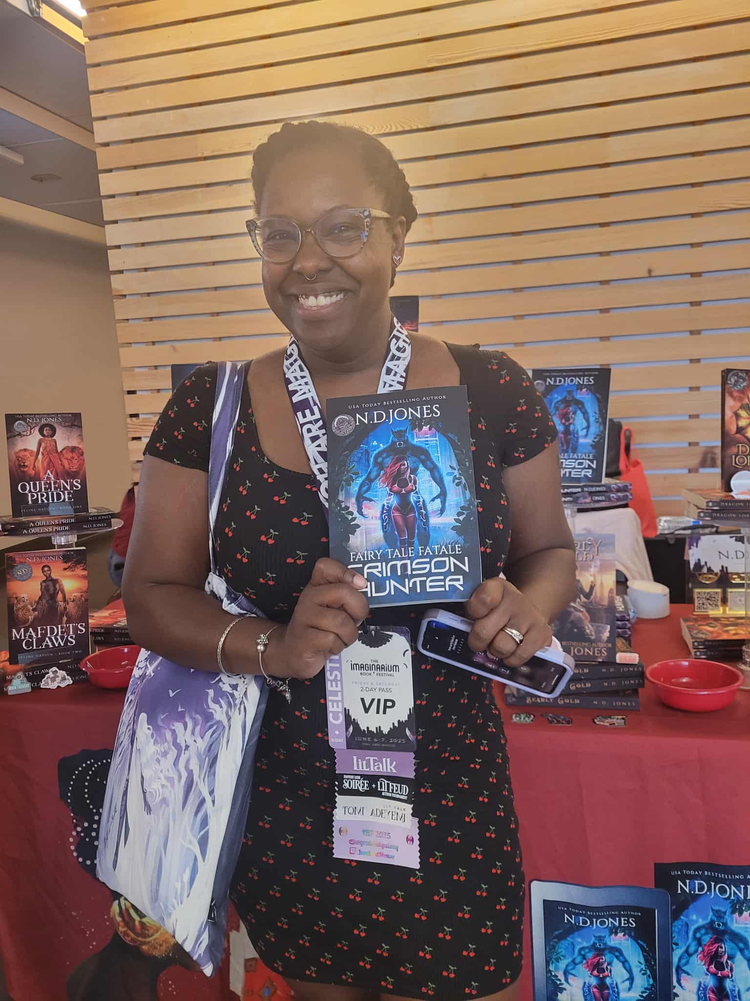 Reader enjoying a novel by African American fantasy and romance author N.D. Jones.