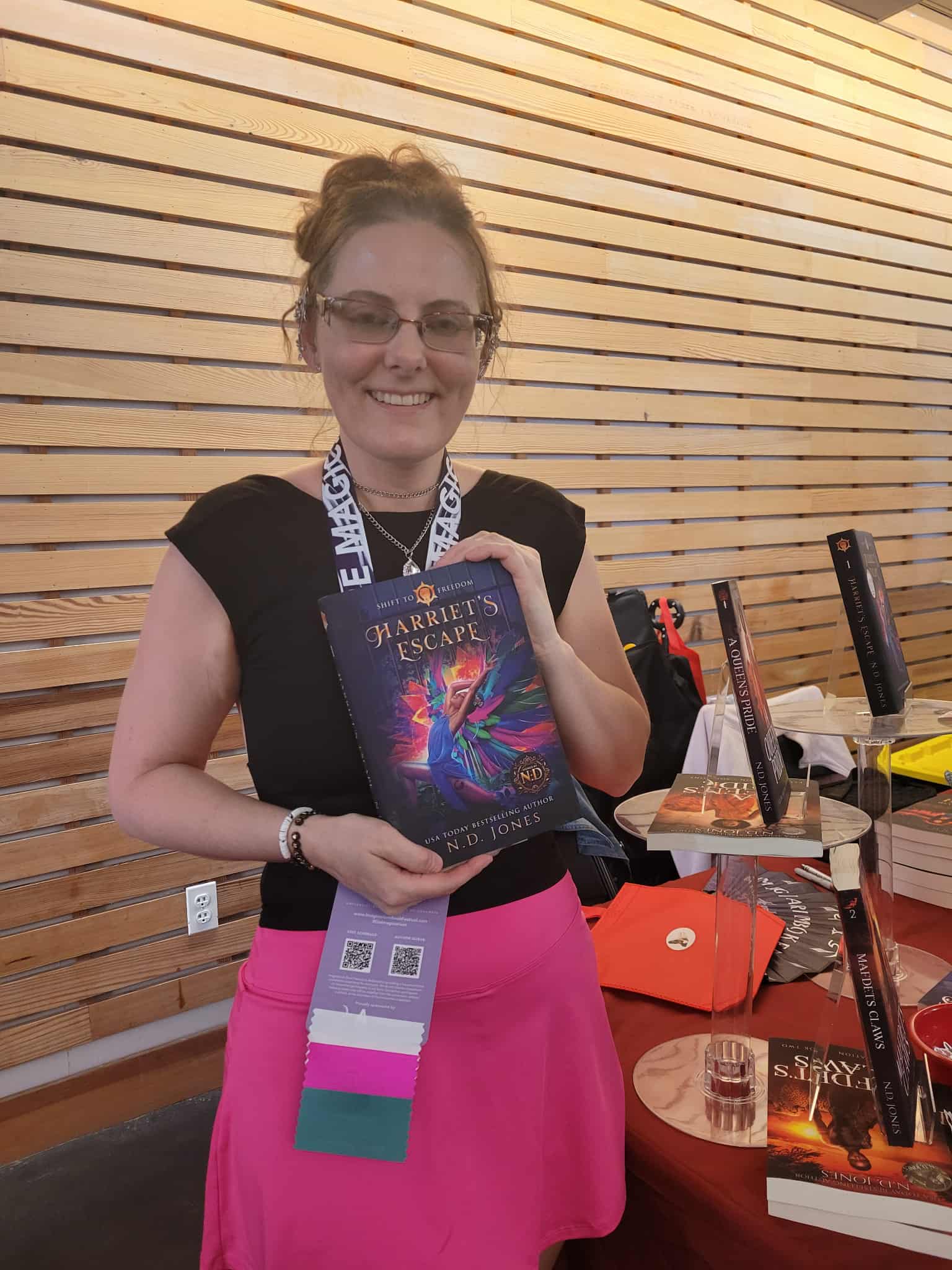 Reader enjoying a novel by African American fantasy and romance author N.D. Jones.